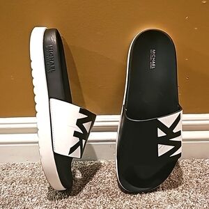 Micheal Kors platform slides, size 10, black and white. Comfortable.